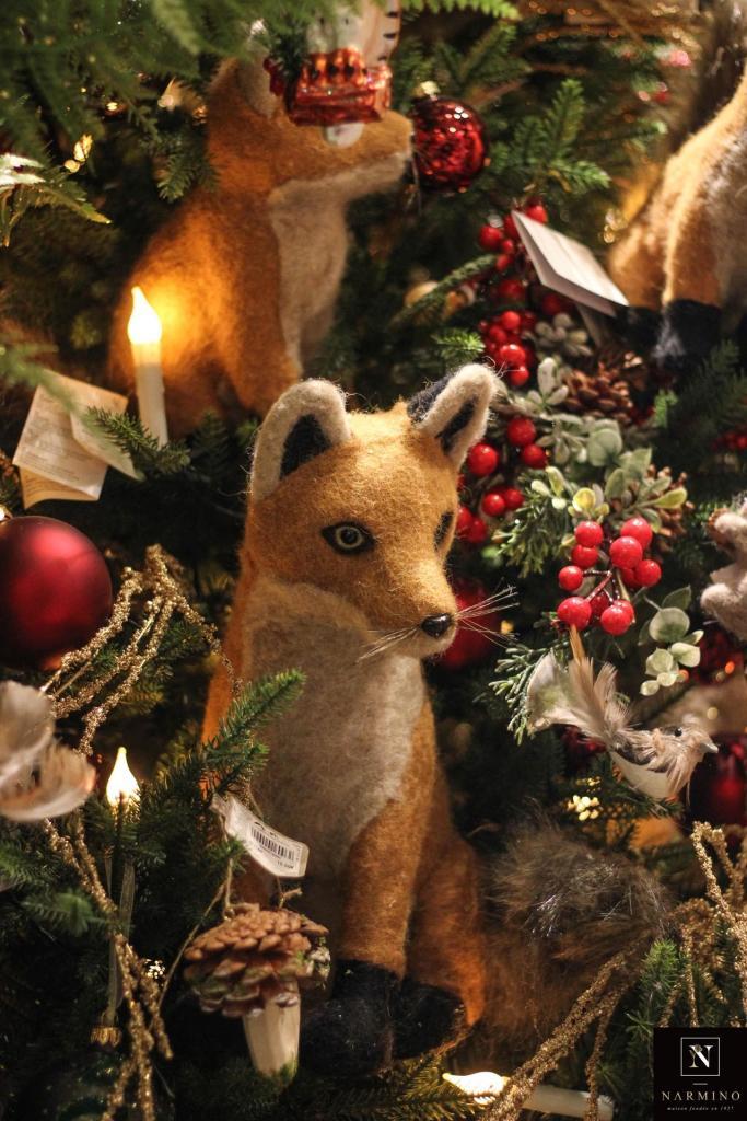A decorative stuffed fox in the store window of Narmino florist in Monaco