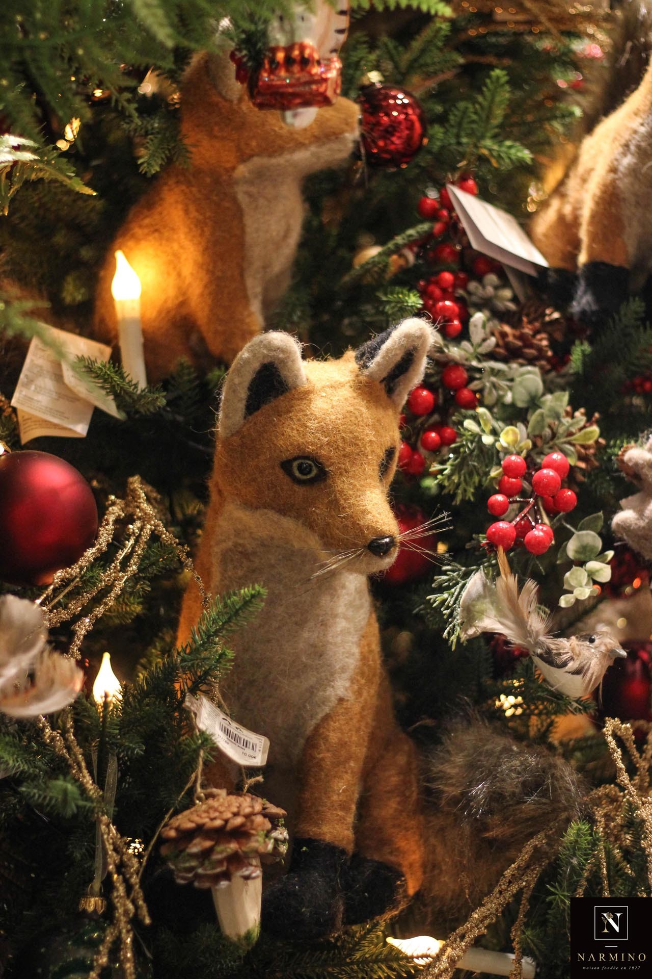 A decorative stuffed fox in the store window of Narmino florist in Monaco