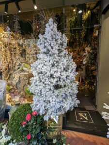 Promotion sur certains sapins et couronnes de Noël