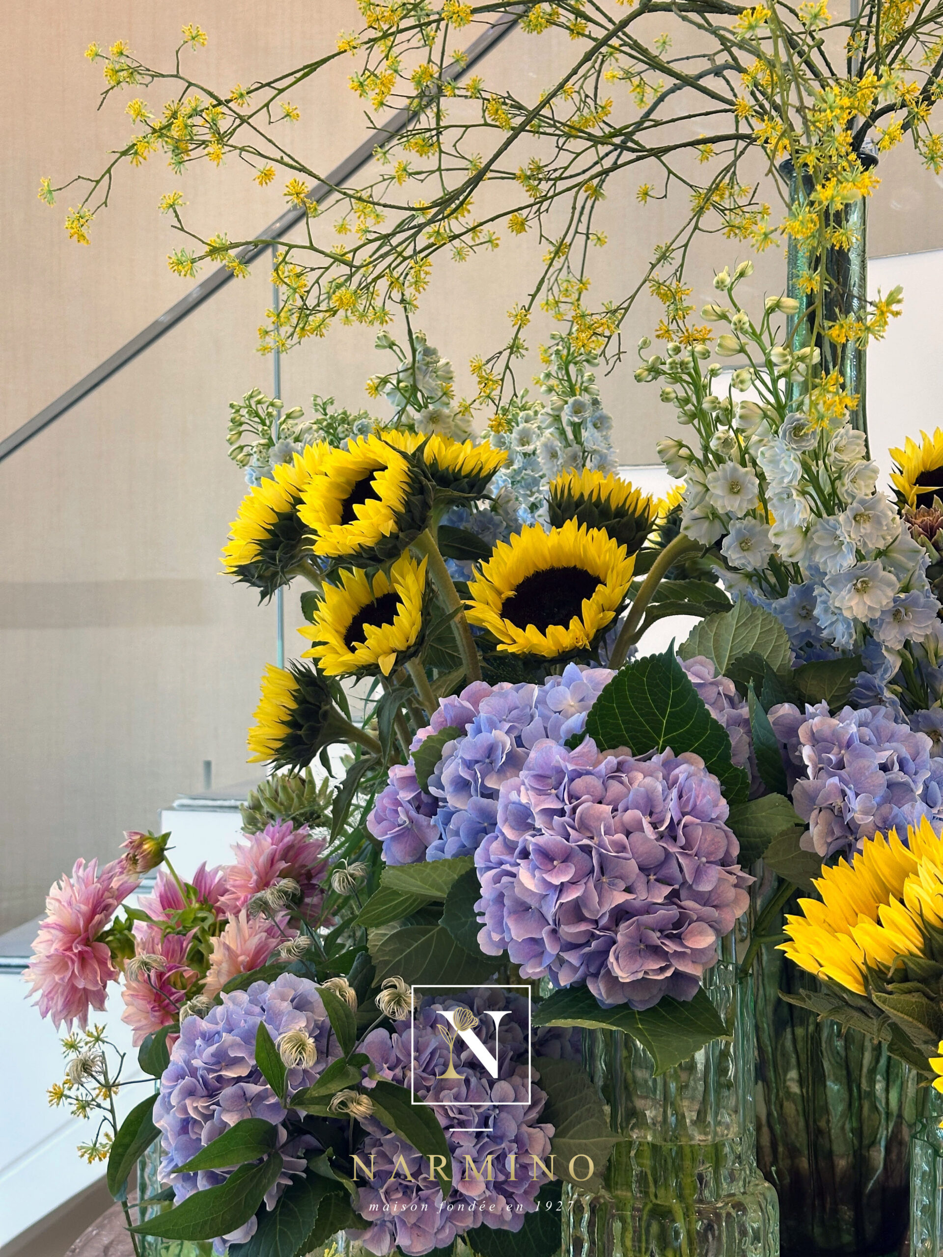 Floral arrangement of yellow sunflowers and mauve hydrangeas created by Narmino in Monaco